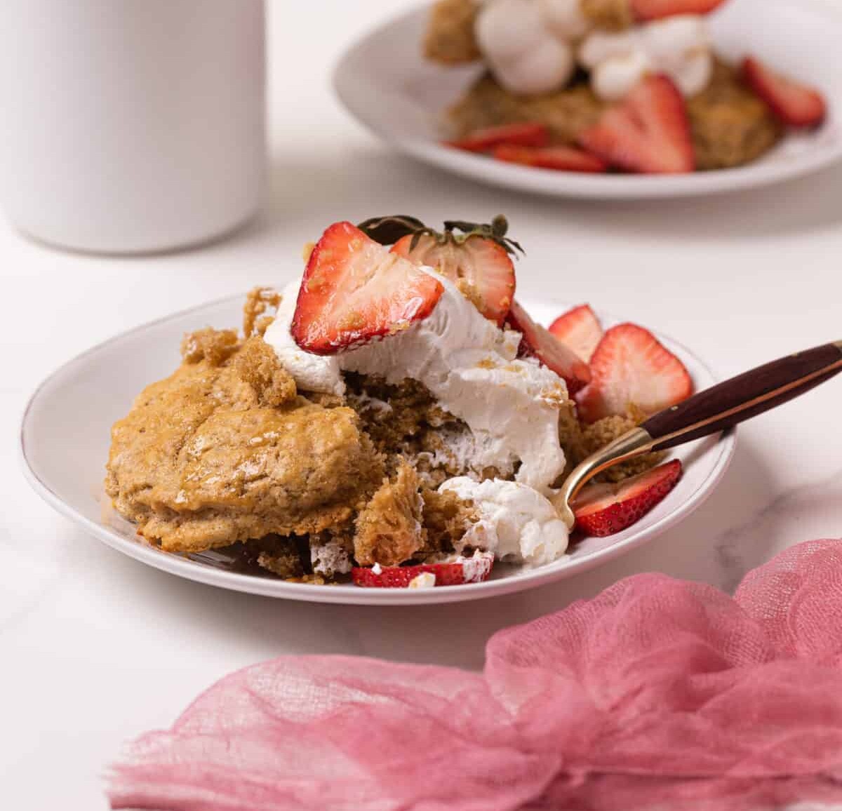 Maple Whole Wheat Oatmeal Strawberry Shortcake on a plate with a fork.