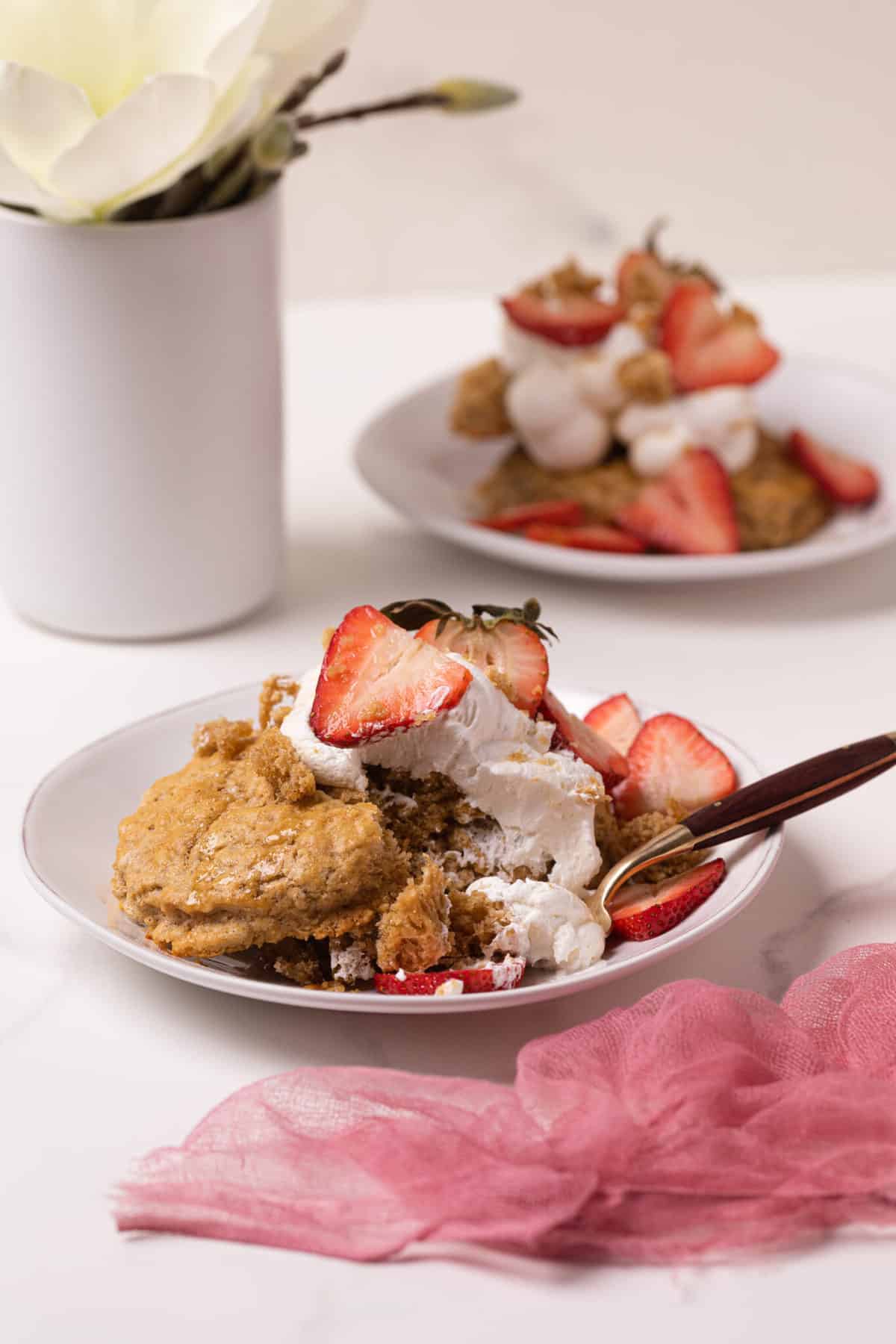 Maple Whole Wheat Oatmeal Strawberry Shortcake on a plate with a fork.