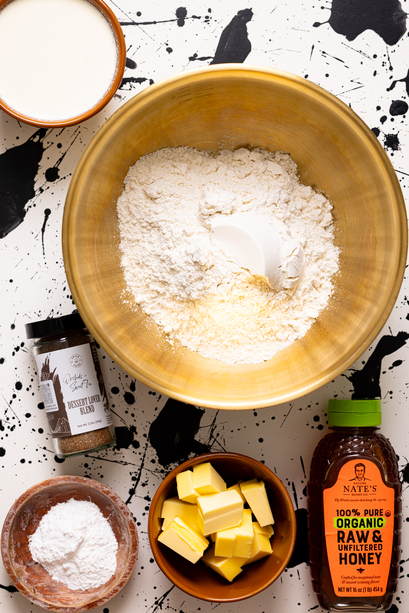Biscuit ingredients on a black and white table.