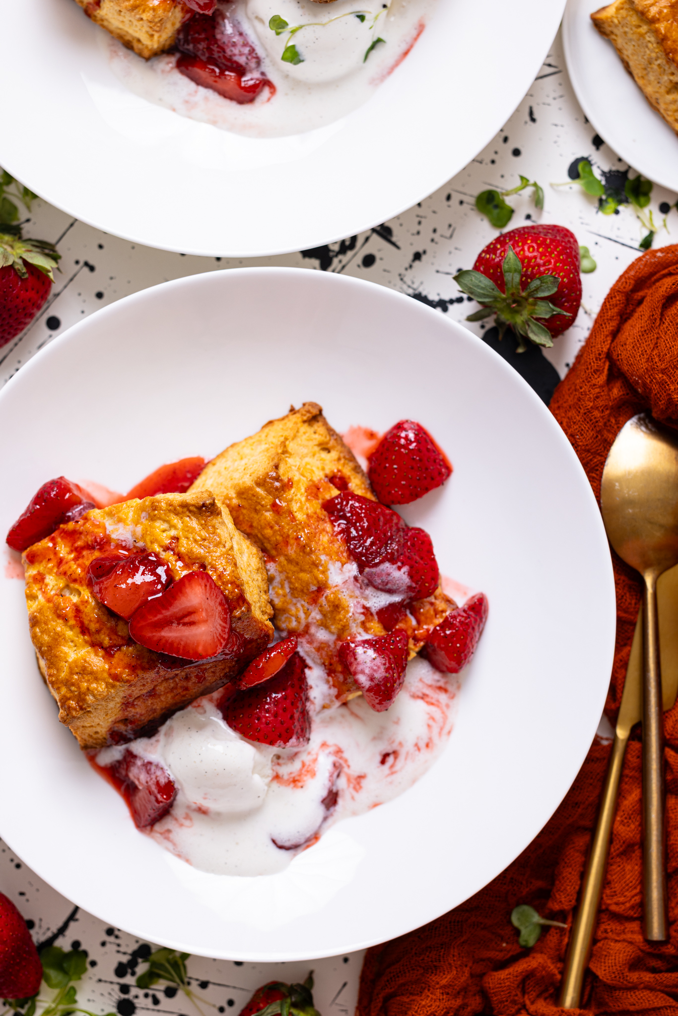 My Fave Strawberry Shortcake Biscuits on a white plate with spoons.
