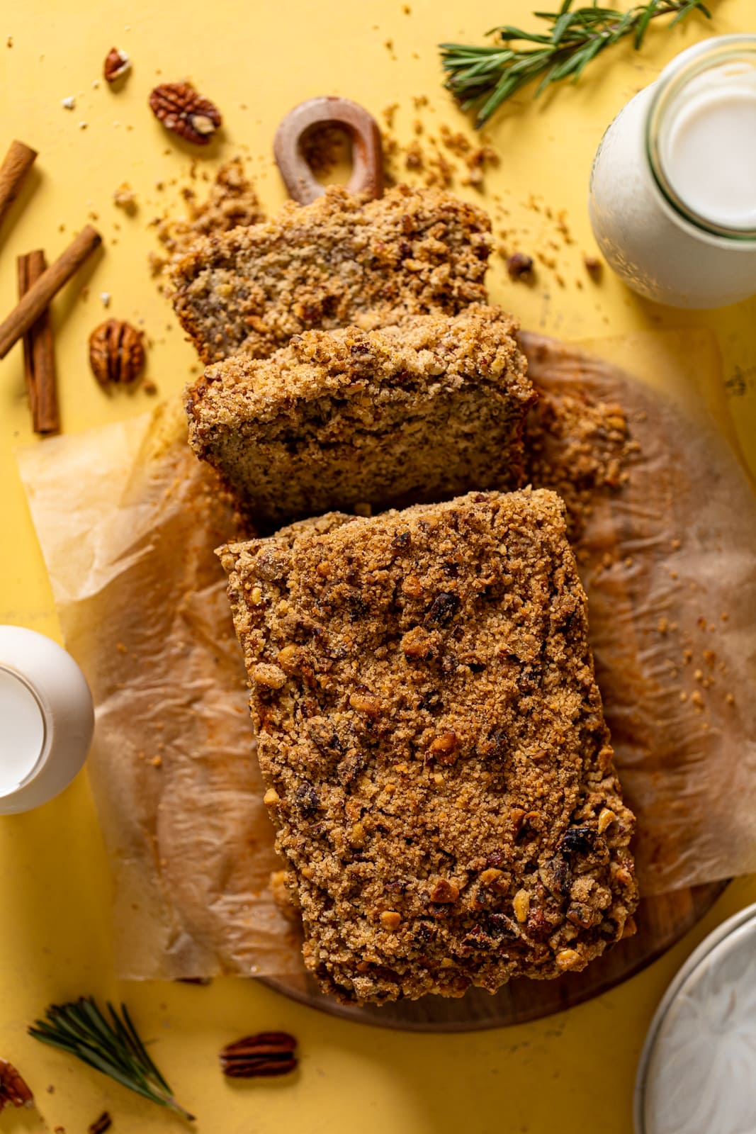 Overhead shot of a loaf of Vegan Cinnamon Crunch Banana Bread, partially sliced