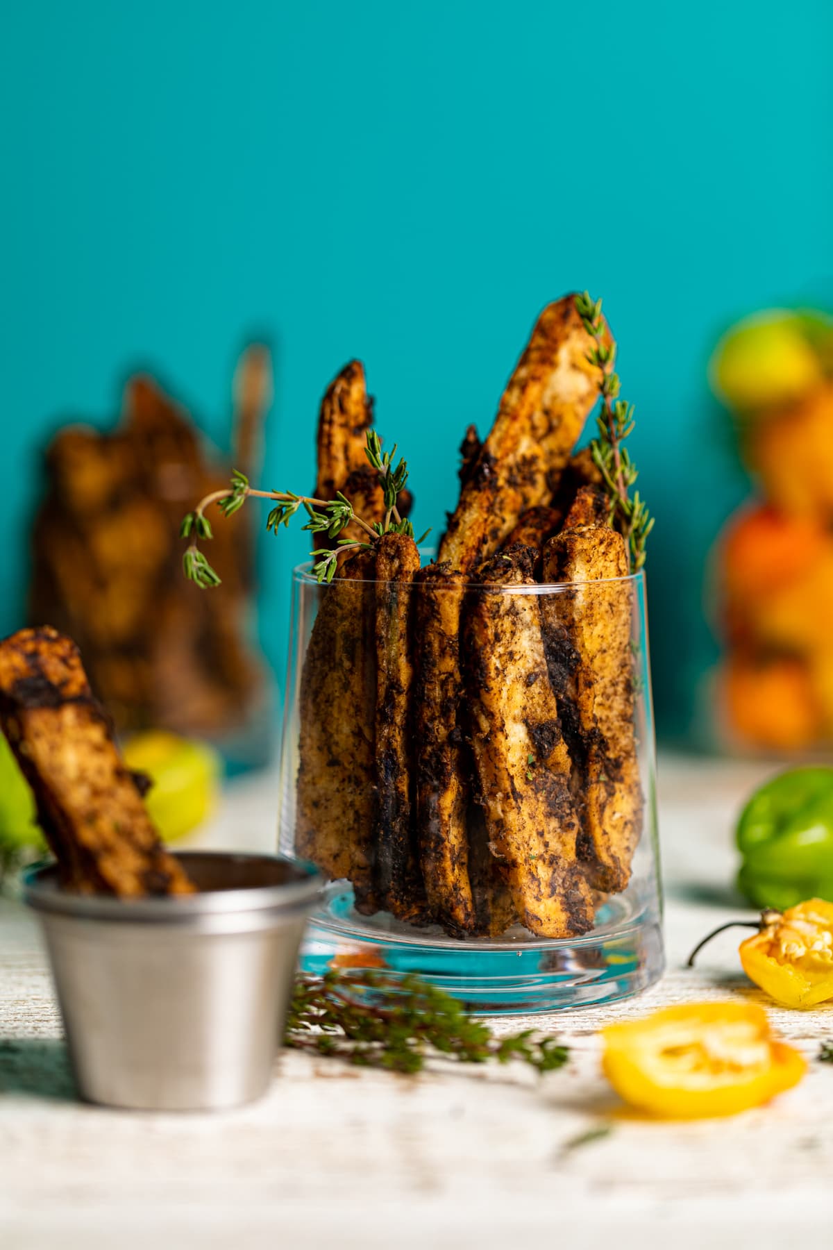 Glass stuffed with Crispy Baked Jerk Potato Wedges and thyme