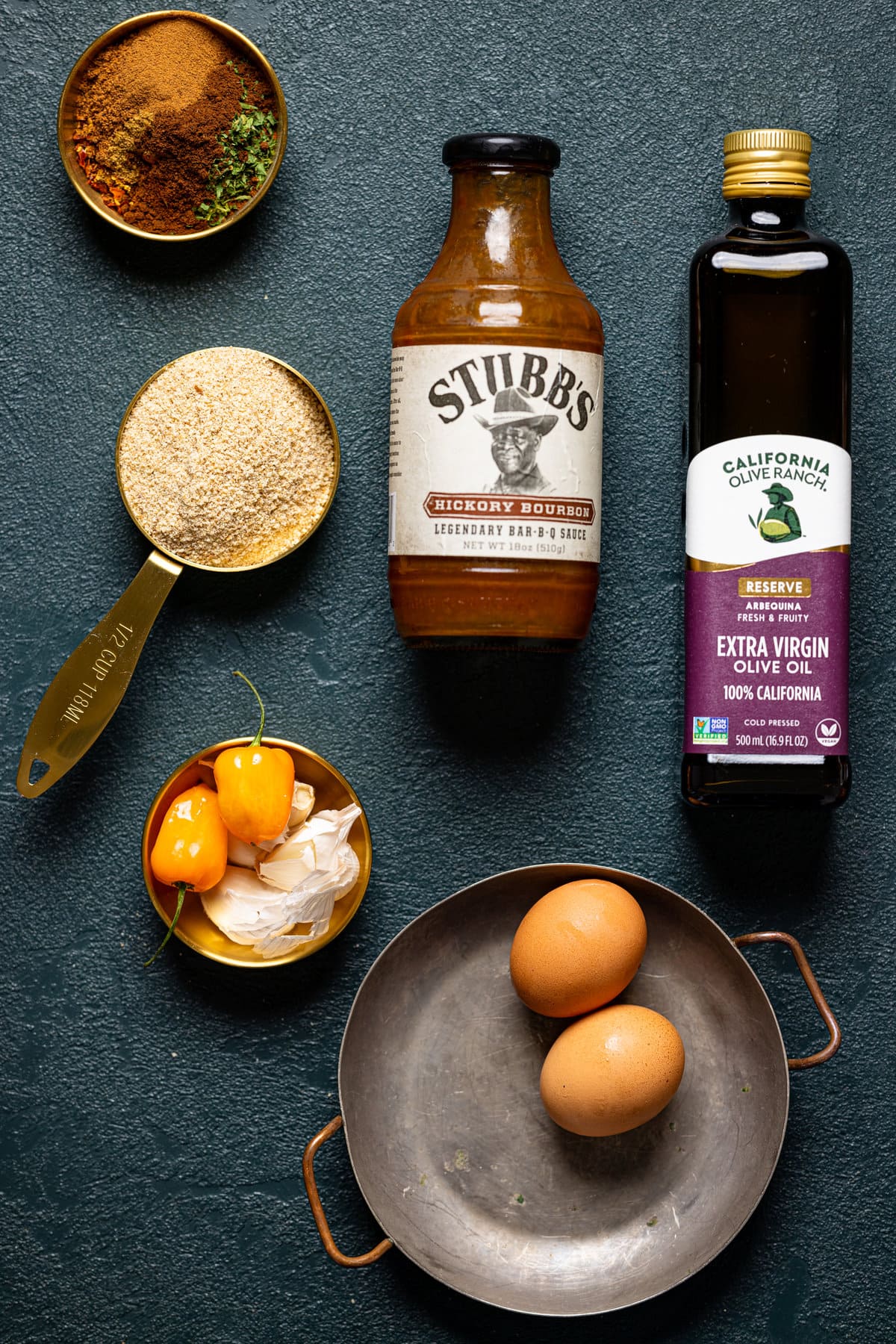 Ingredients for BBQ Jerk Salmon Burgers including eggs, olive oil, and Stubb\'s barbeque sauce