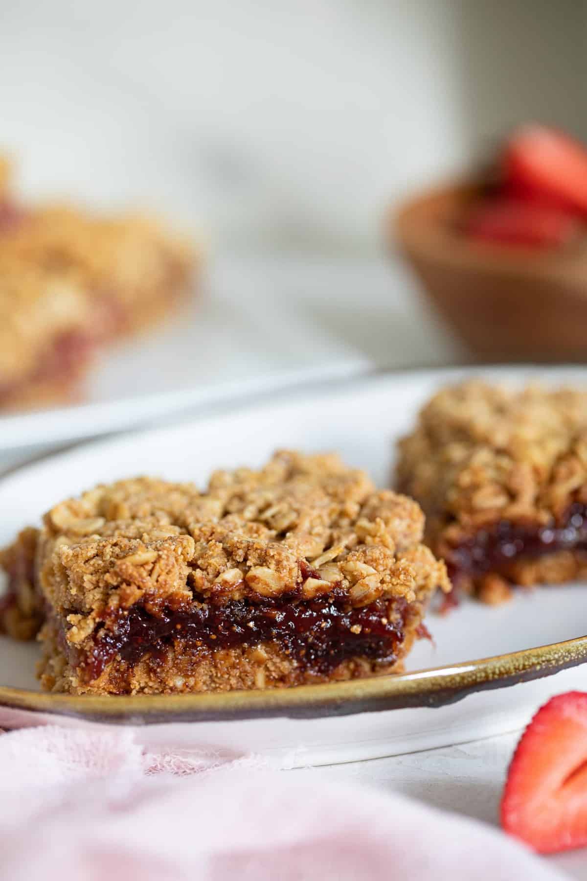 Vegan Strawberry Peanut Butter Oatmeal Bars on a plate.