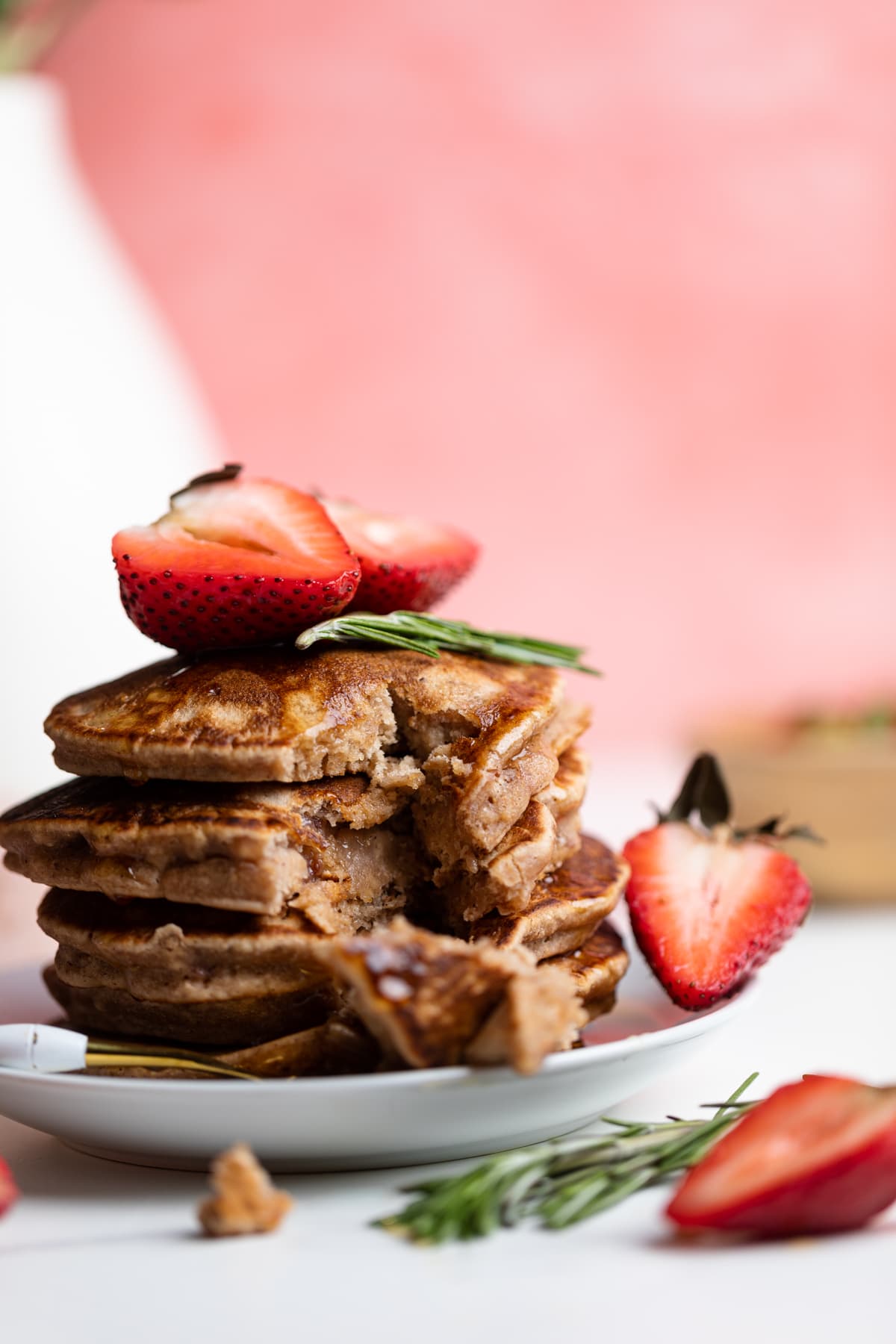 Partially-eaten Whole Wheat Strawberry Pancakes.