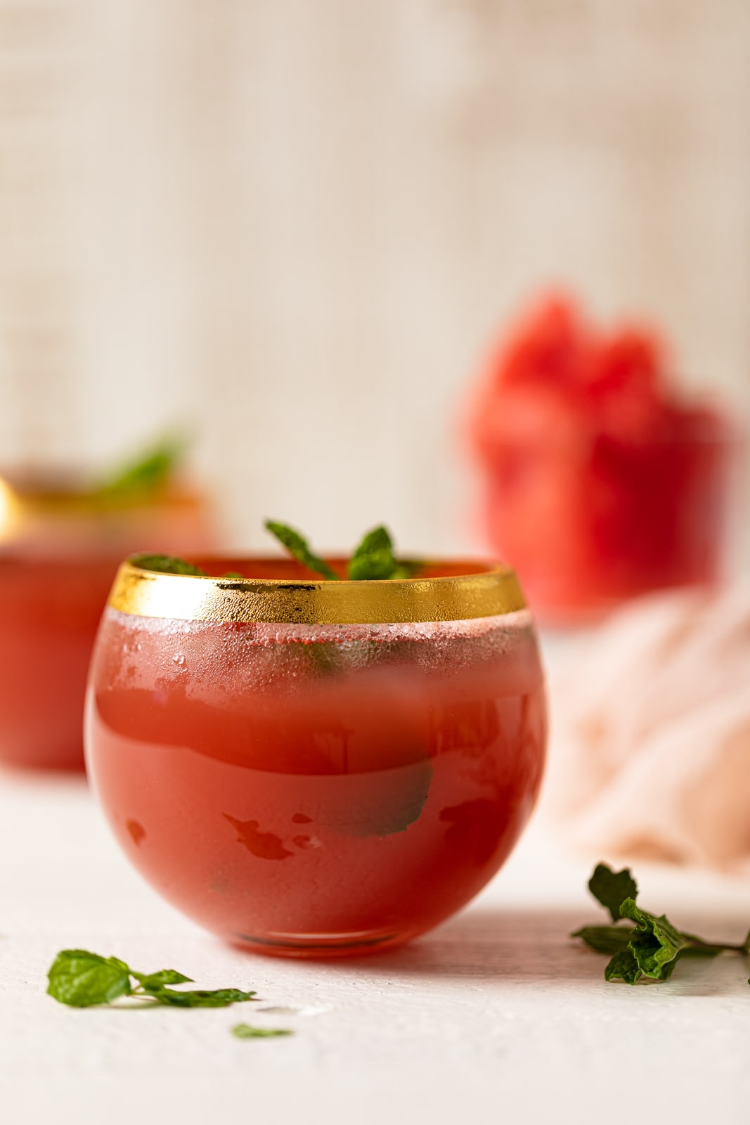 Gold-rimmed glass of Fresh Watermelon Cucumber Mint Juice.