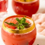 Fresh Watermelon Cucumber Mint Juice in a gold-rimmed glass.