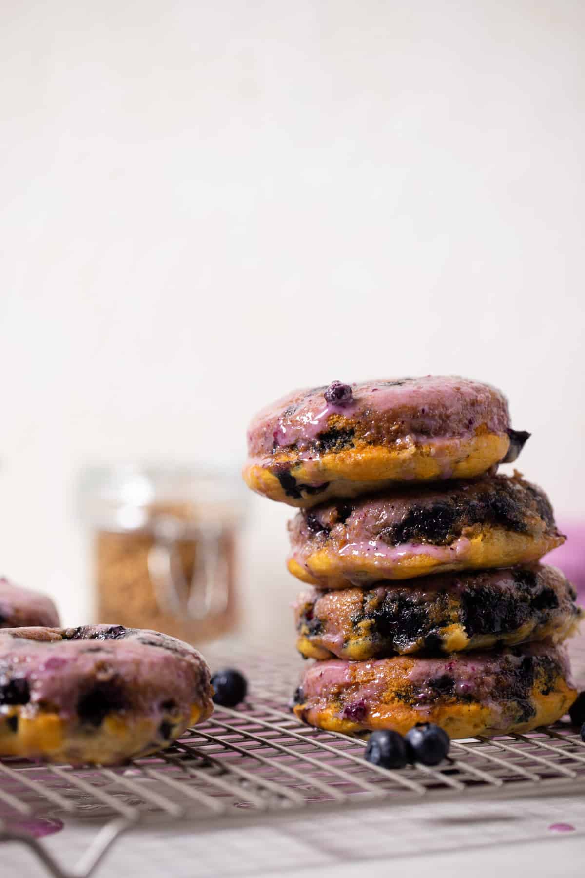 Stack of Blueberry Vegan Donuts with Blueberry Glaze.