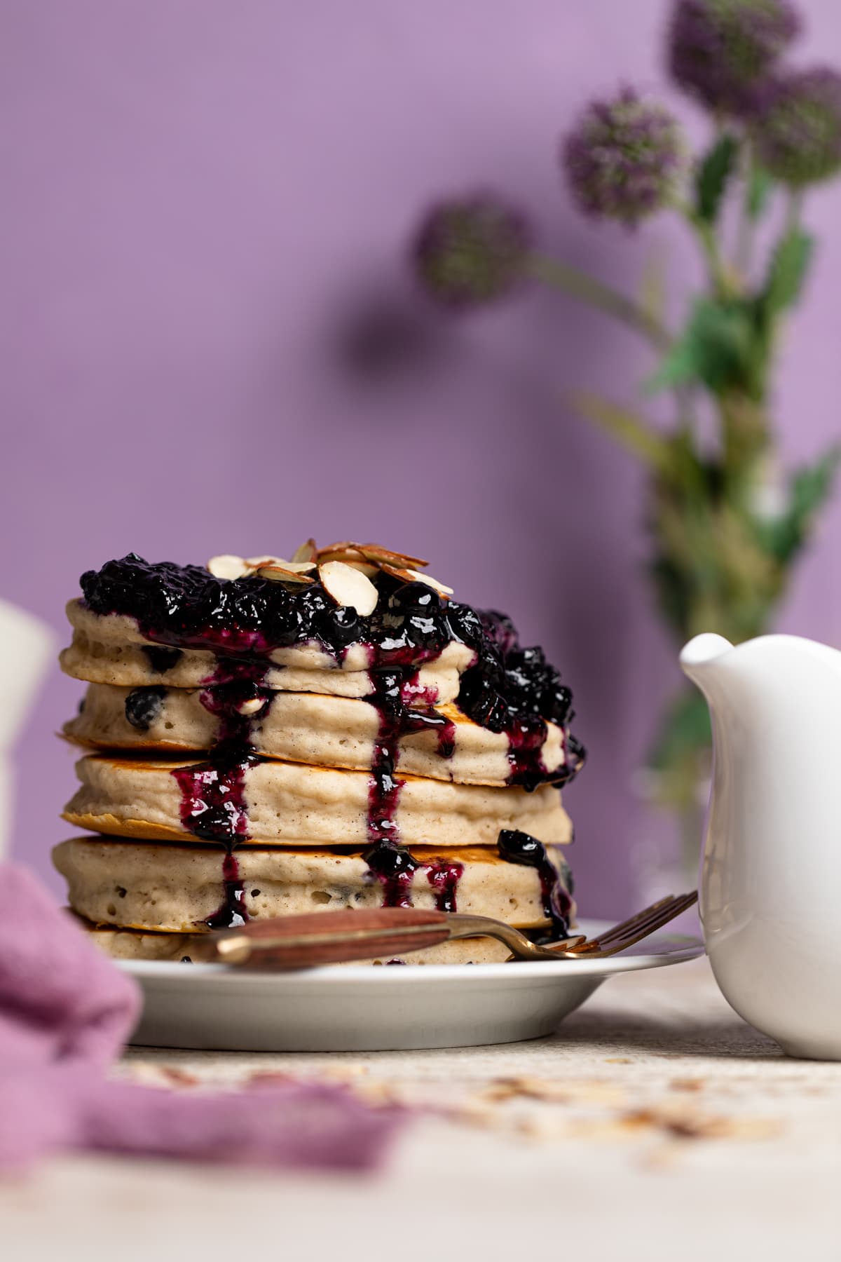 Stack of Dairy-Free Almond Blueberry Pancakes on a plate
