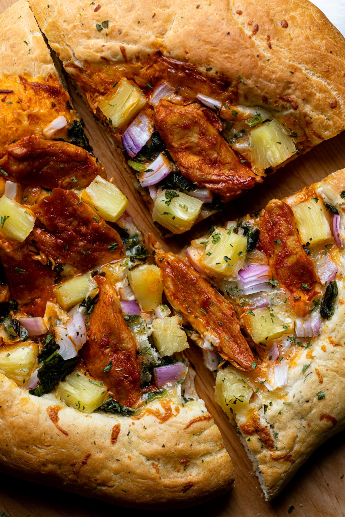 Closeup of a Plant-based Hawaiian Buffalo \'Chicken\' Pizza.