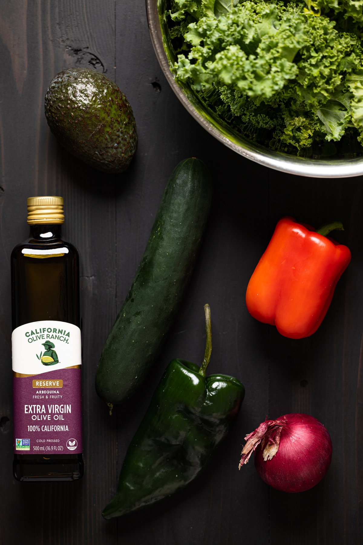 Ingredients for Baked Jamaican Jerk Chicken Salad including red pepper, red onion, kale, and avocado