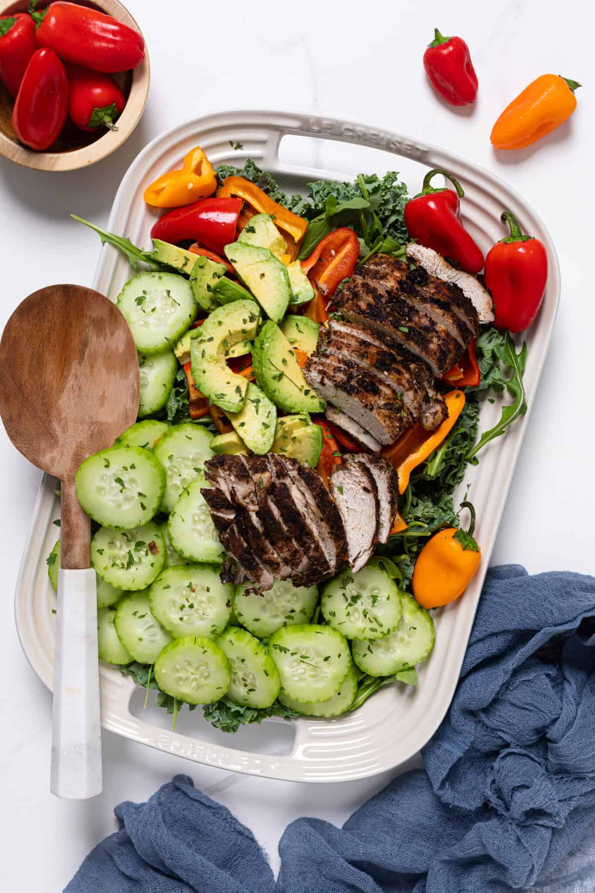 Oven Baked Jamaican Jerk Chicken Salad on a white tray.