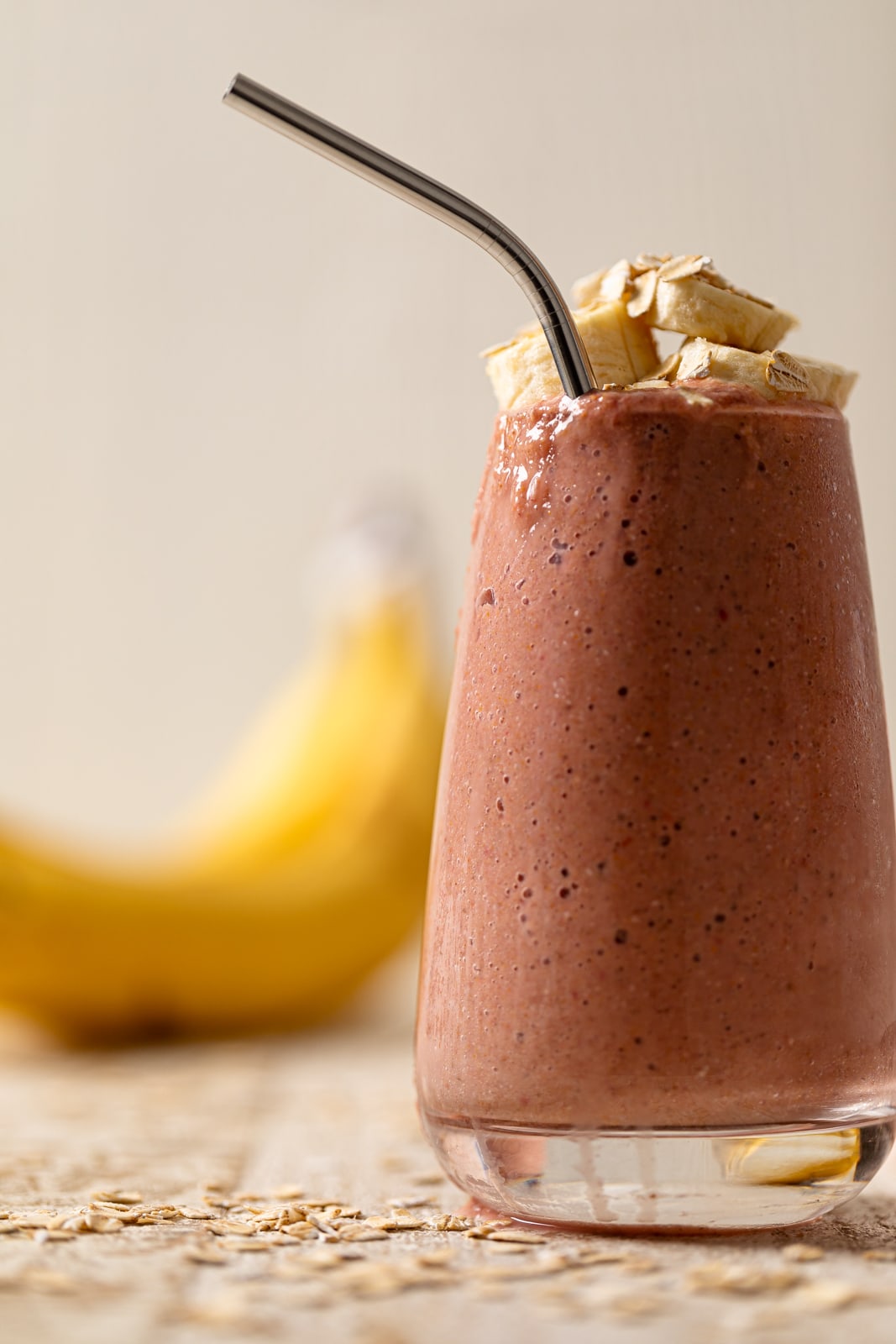 Metal spoon in a Raspberry ‘Sunrise’ Smoothie.