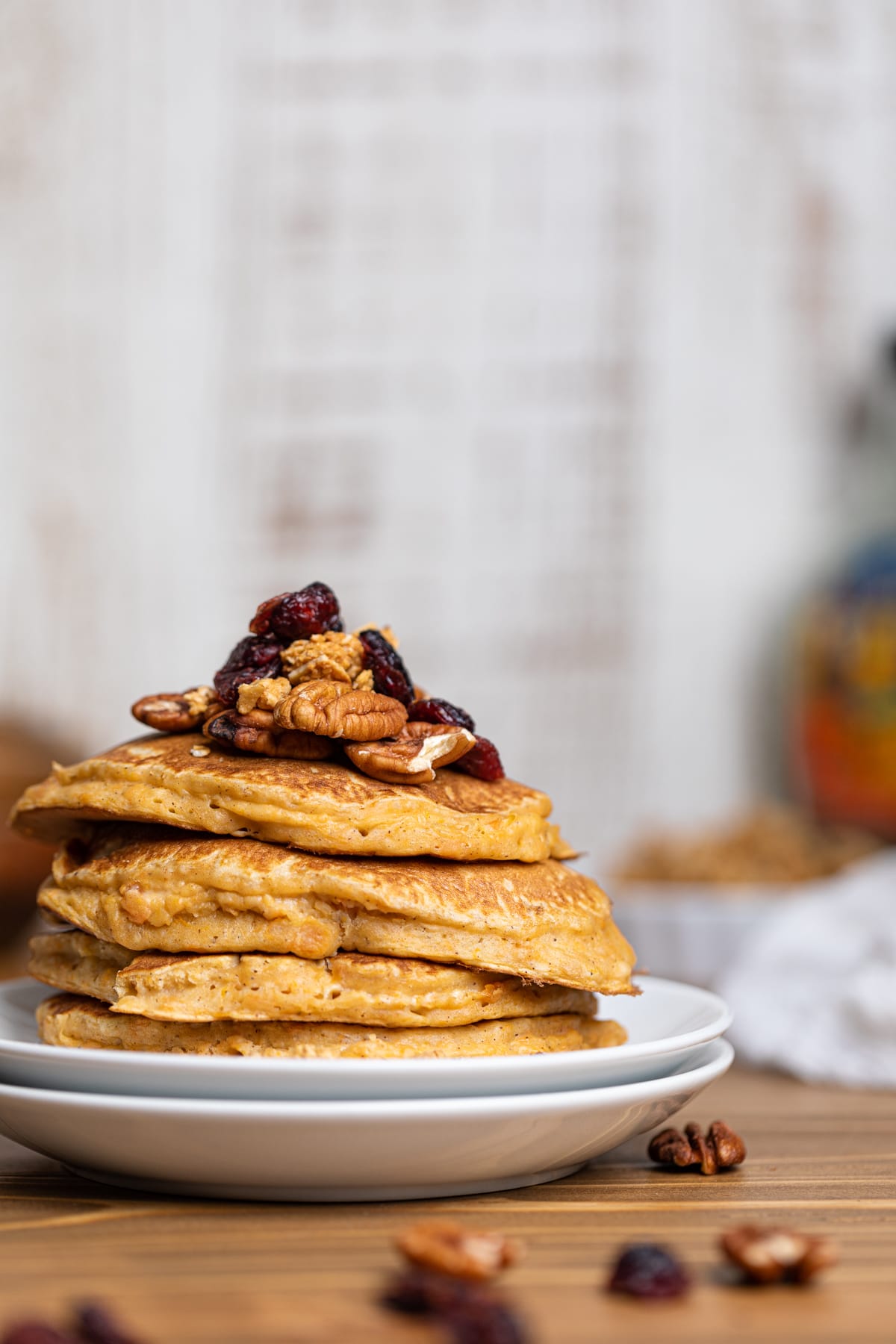 Sweet Potato Pancakes piled on two stacked plates.