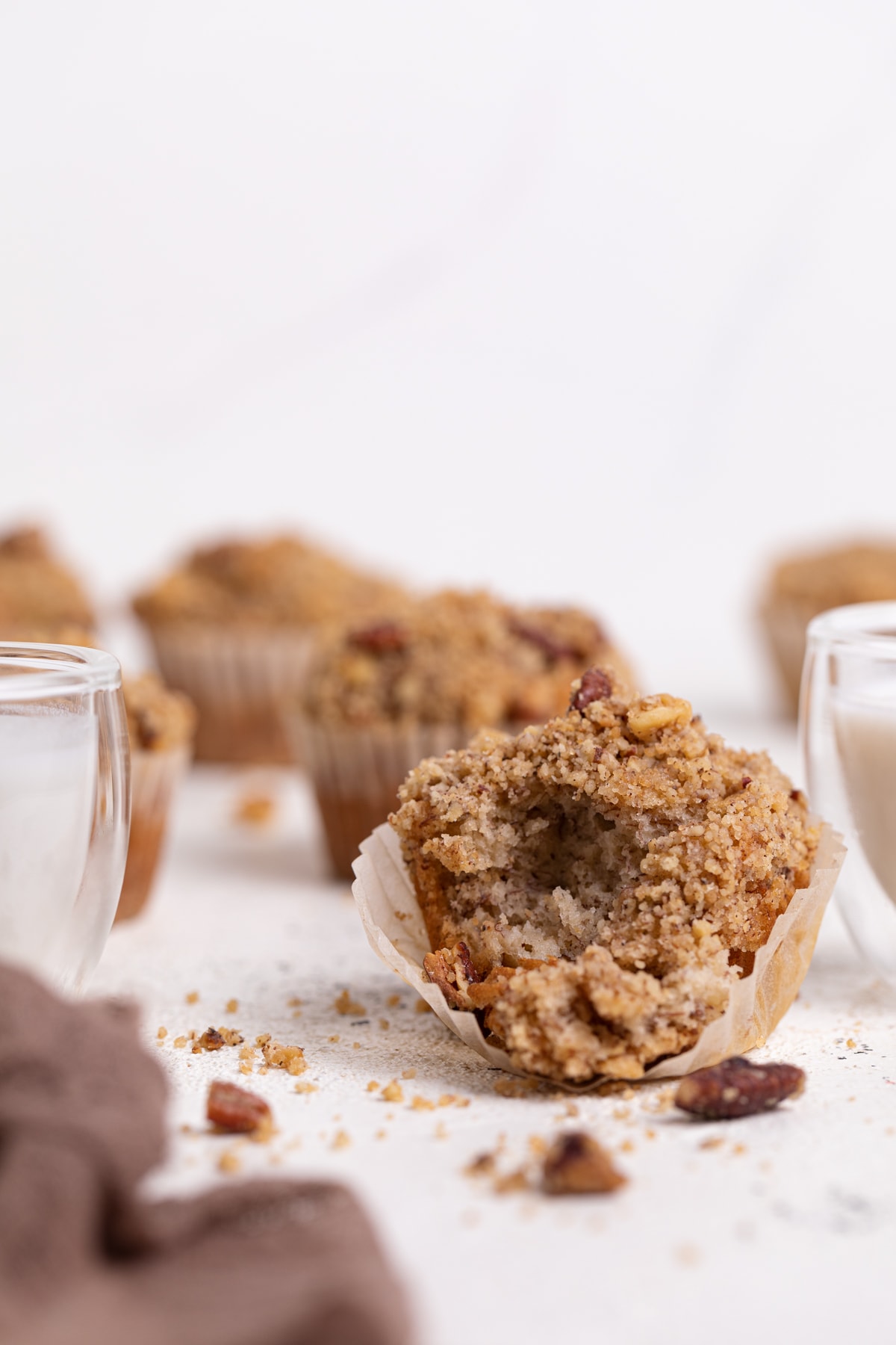 Vegan Banana Muffin with cinnamon streusel with a bite removed.