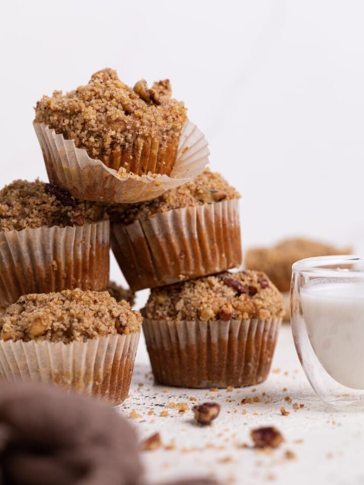 Stack of Vegan Cinnamon Banana Crumble Muffins.