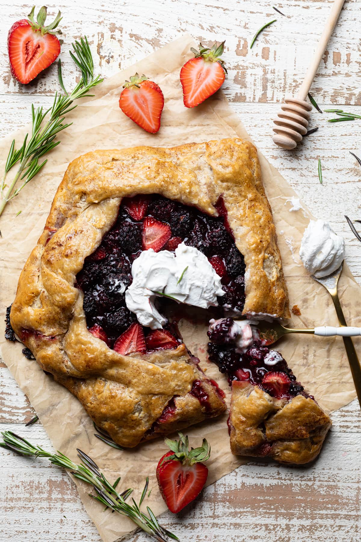 Knife cutting a slice from a Vegan Berry Galette.