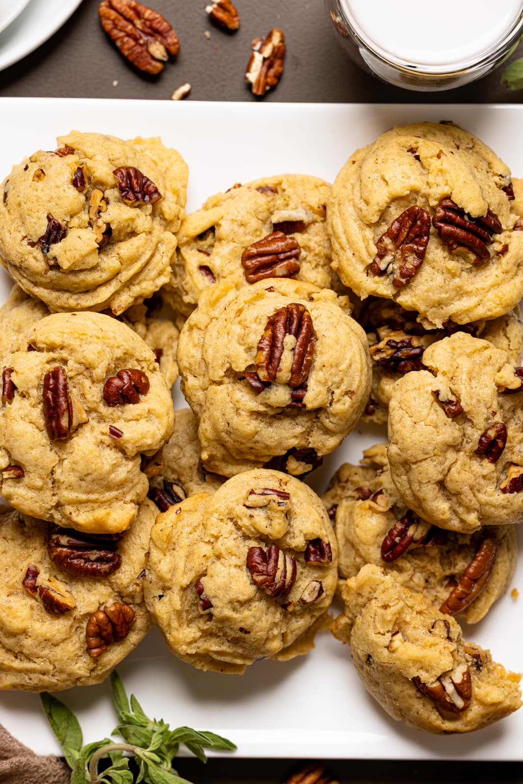 Up close shot of baked cookies on a white plate.