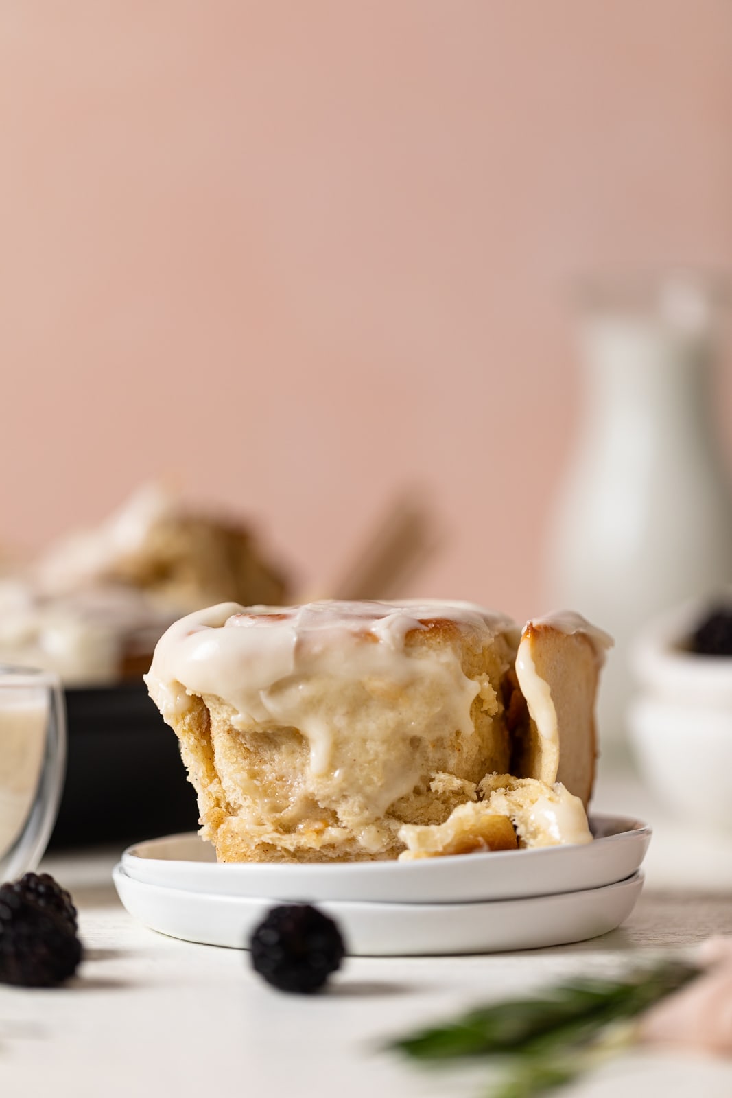 Delicious Homemade Classic Cinnamon Roll on two small, stacked plates.