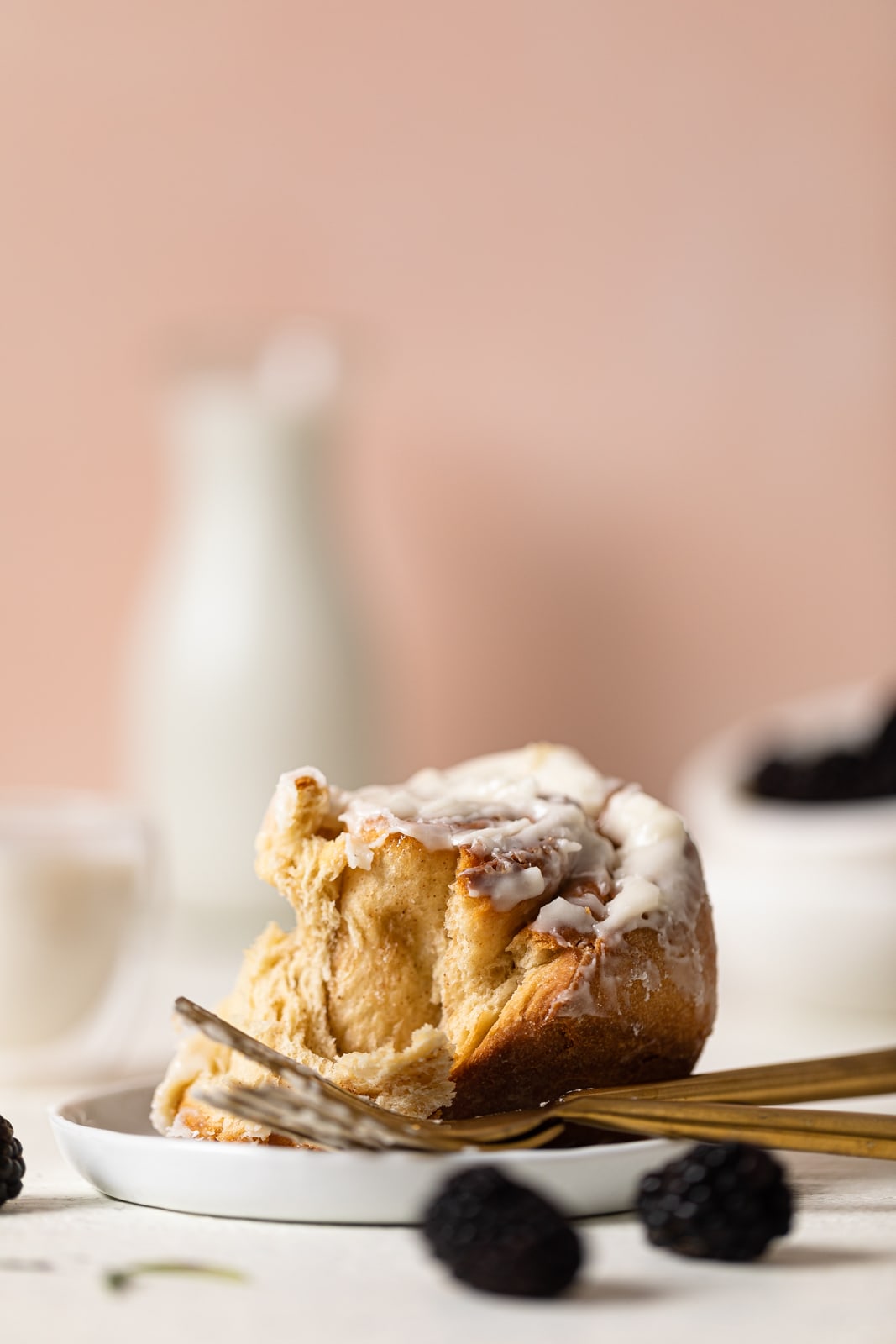 Cinnamon Roll and a fork on a plate.