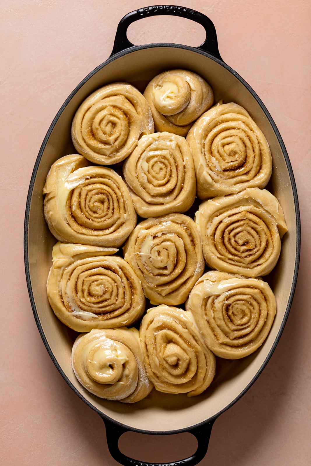 Uncooked Cinnamon Rolls in a baking dish.