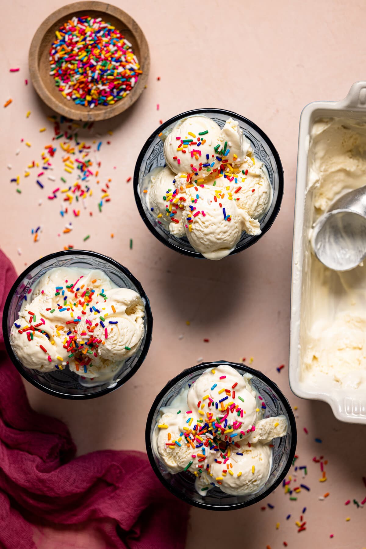 Three bowls of No-Churn Vanilla Ice Cream topped with sprinkles.