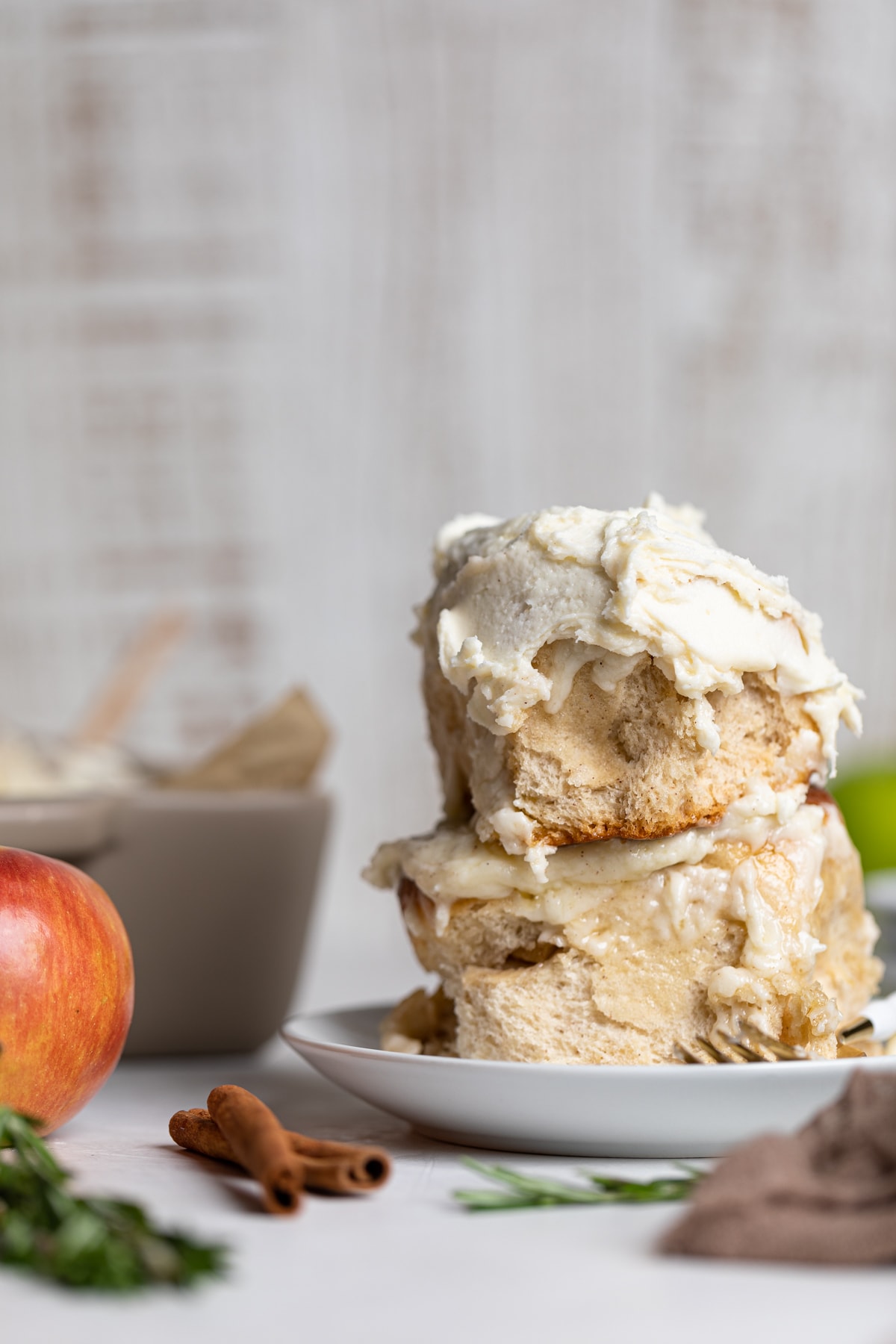 Two stacked Vegan Apple Cinnamon Rolls