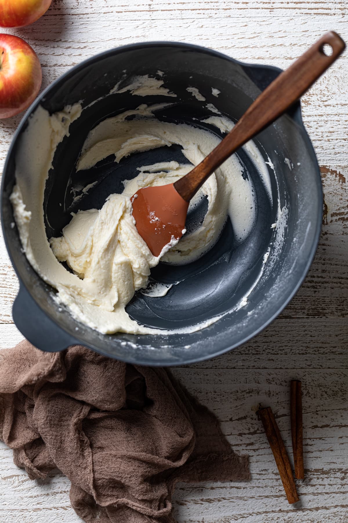 Spatula stirring a bowl of maple glaze