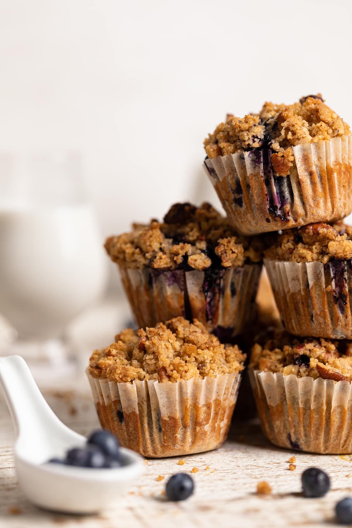 Stack of Vegan Banana Blueberry Pecan Crumble Muffins 