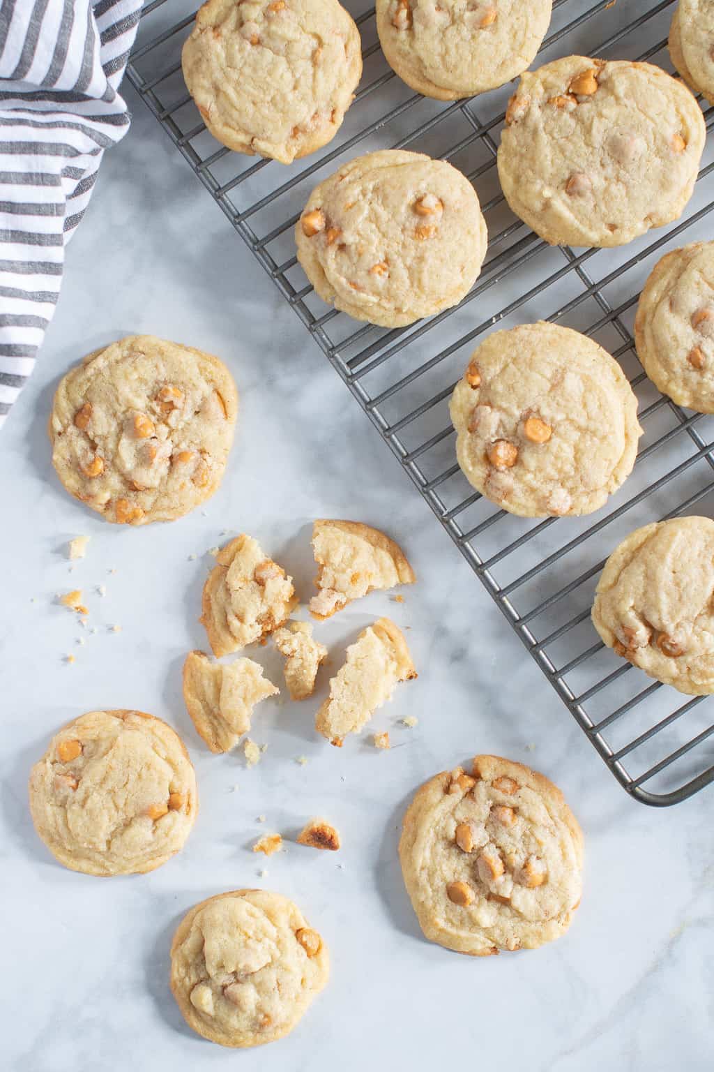 Soft and Crisp Crinkled Butterscotch Cookies on and next to a wire rack.