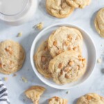 Soft and Crisp Crinkled Butterscotch Cookies on and around a plate.