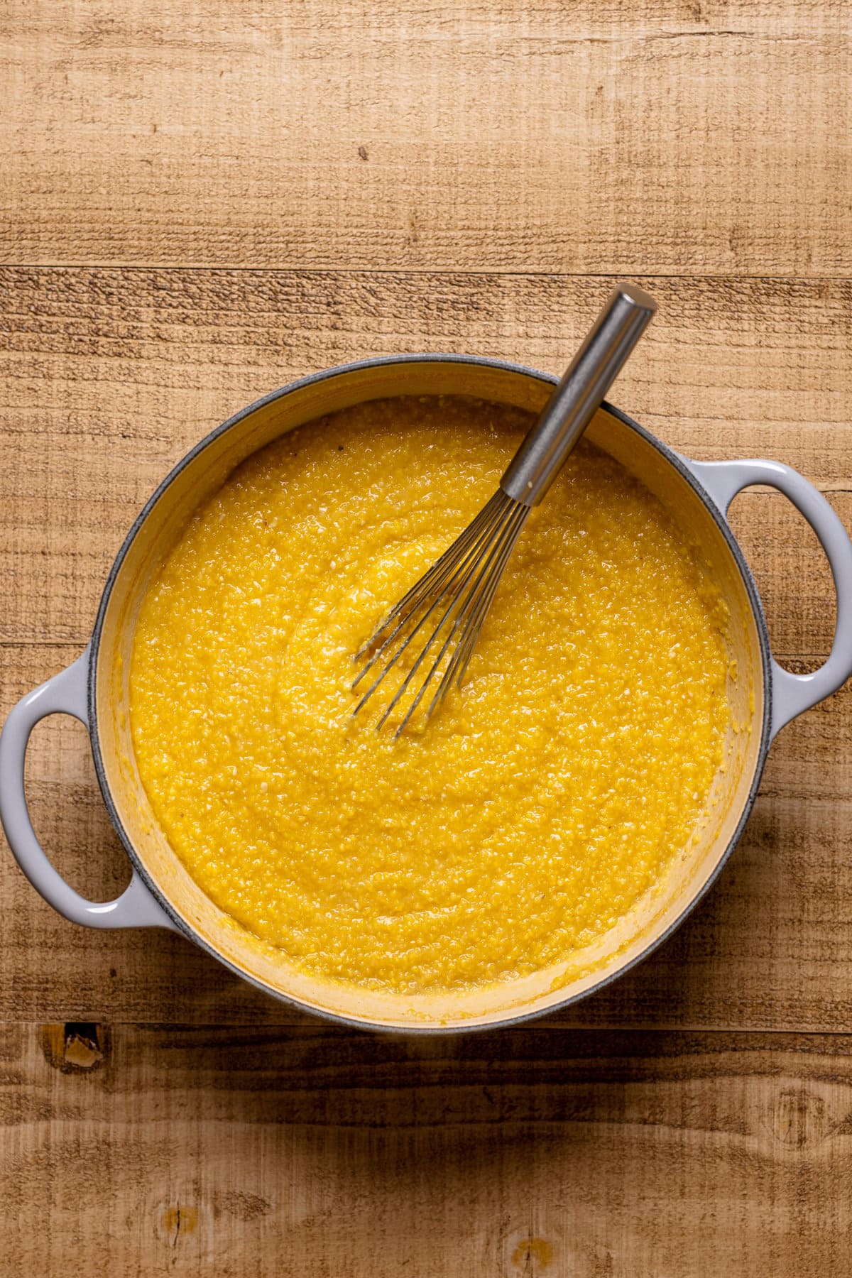 Whisk in a Dutch oven of Polenta