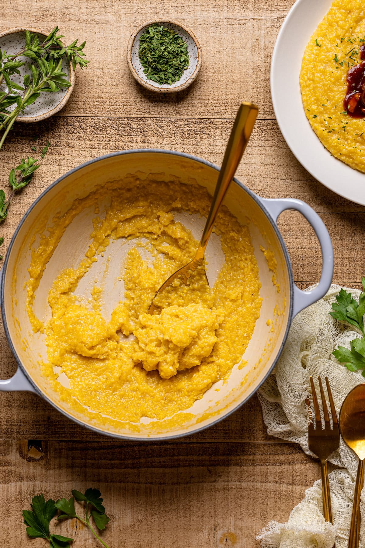 Mostly-empty Dutch oven of polenta