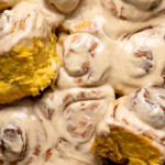 Up close shot of frosted cinnamon rolls.