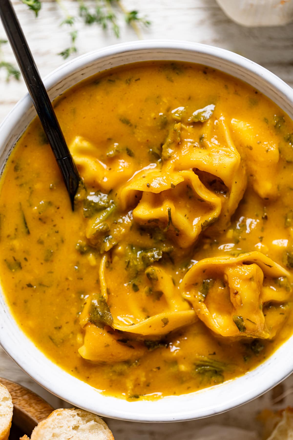 Closeup of a bowl of Creamy Cajun Pumpkin Tortellini Soup