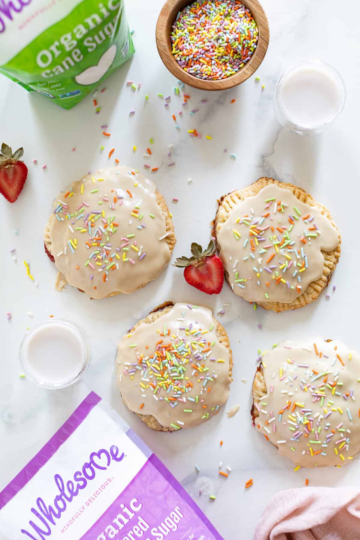 Homemade Vegan Strawberry Pop Tarts topped with sprinkles.