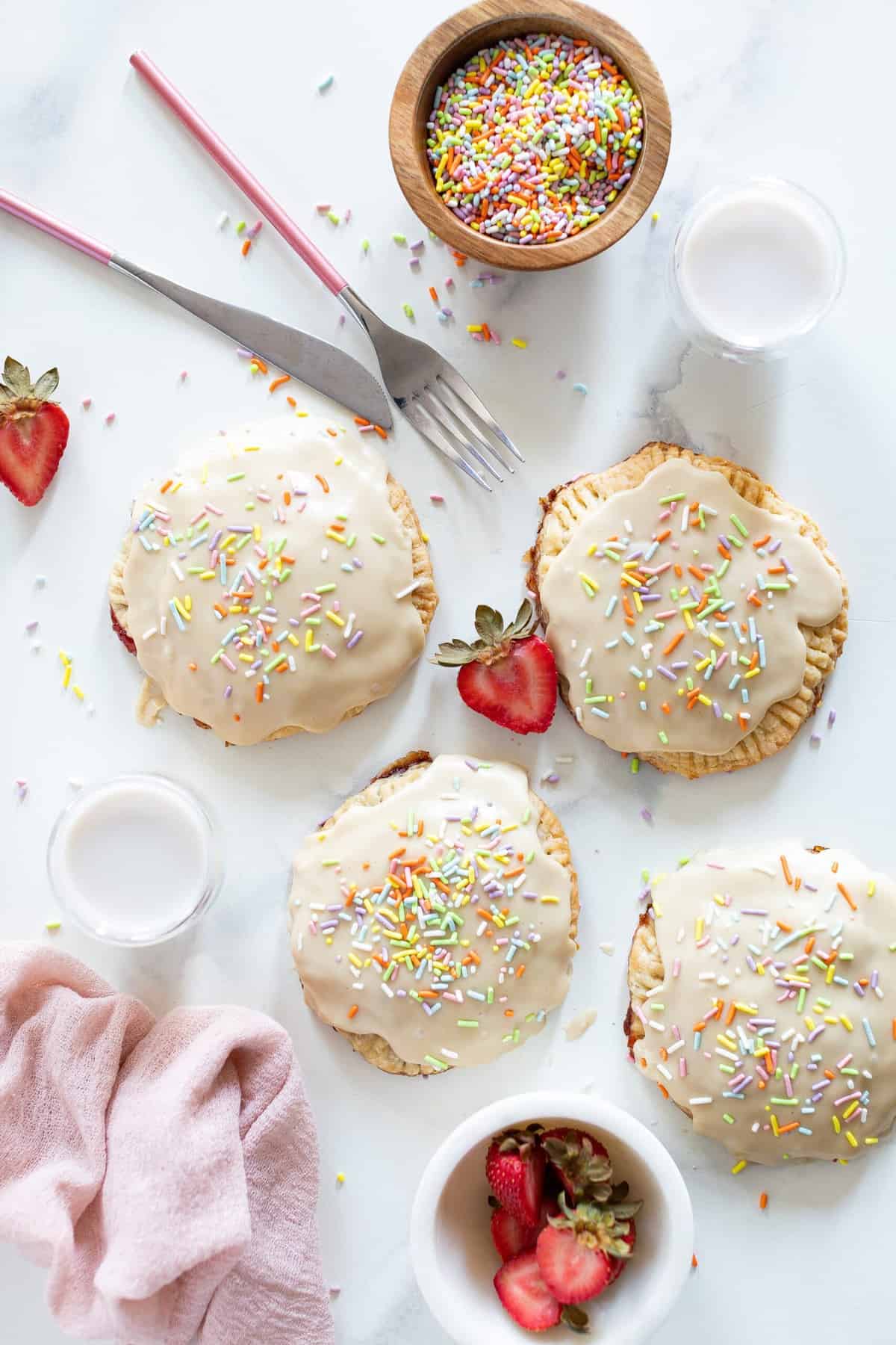 Homemade Vegan Strawberry Pop Tarts with strawberries and silverware.