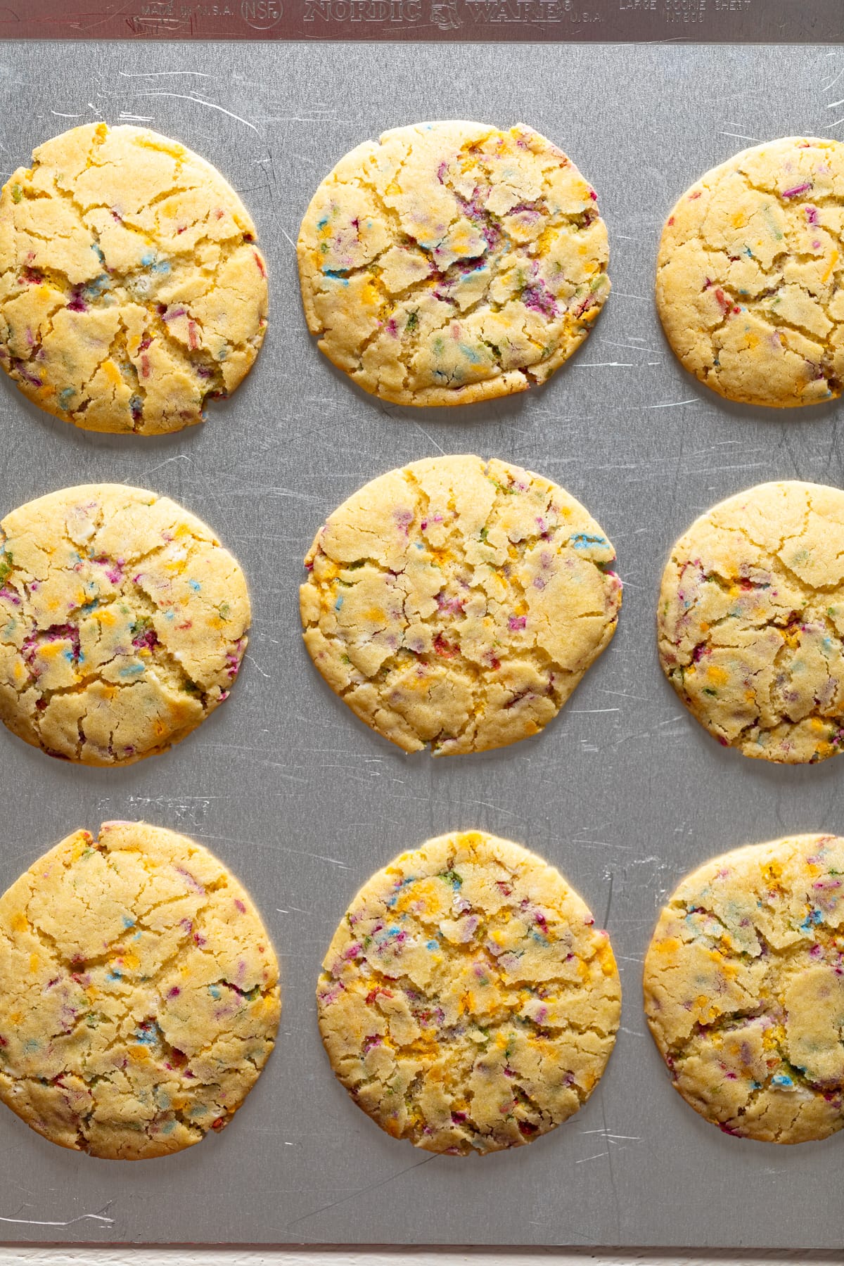 Soft Oversized Crinkled Sprinkle Sugar Cookies on a baking sheet.