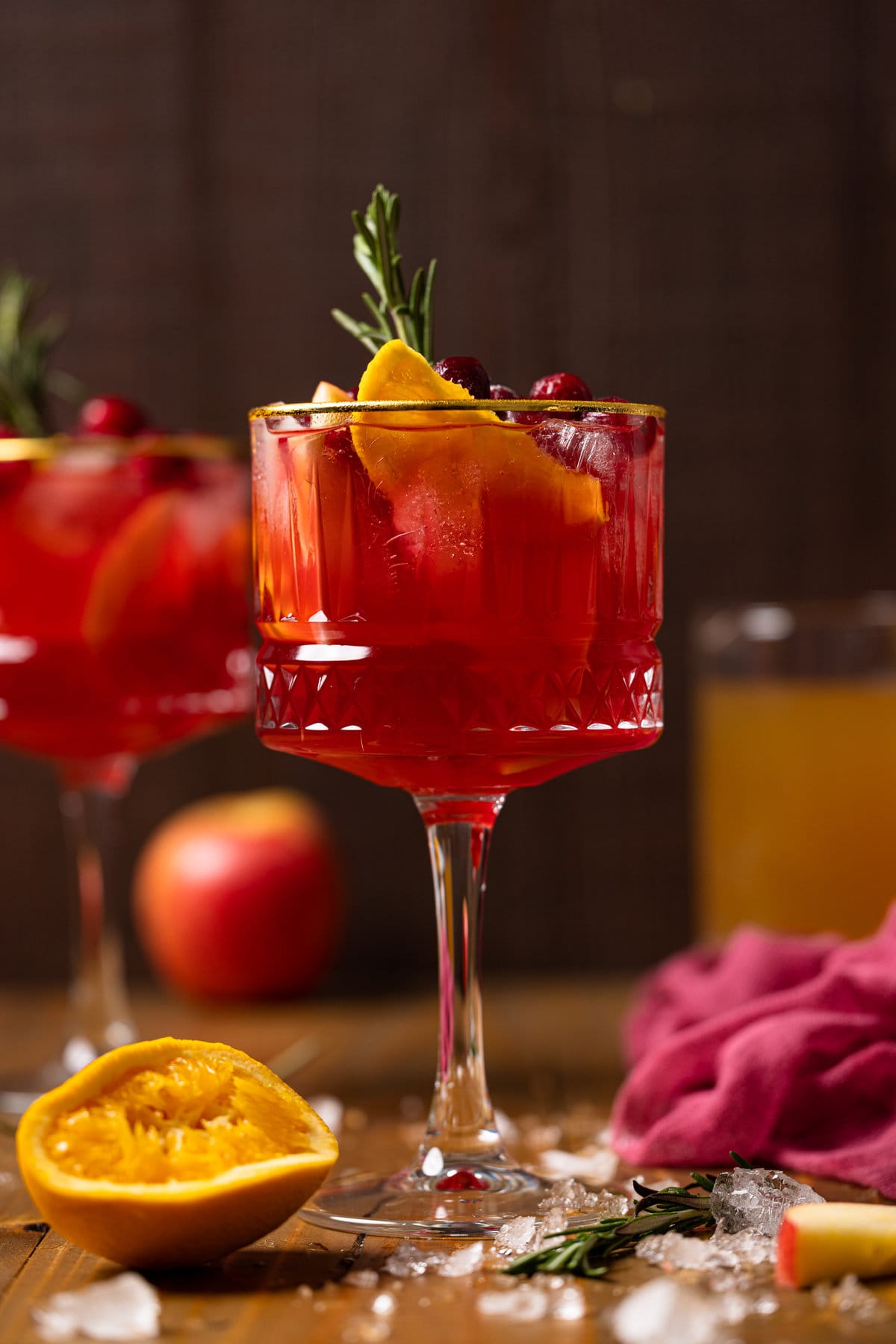 Long-stemmed glass of Cranberry Apple Cider Orange Sangria