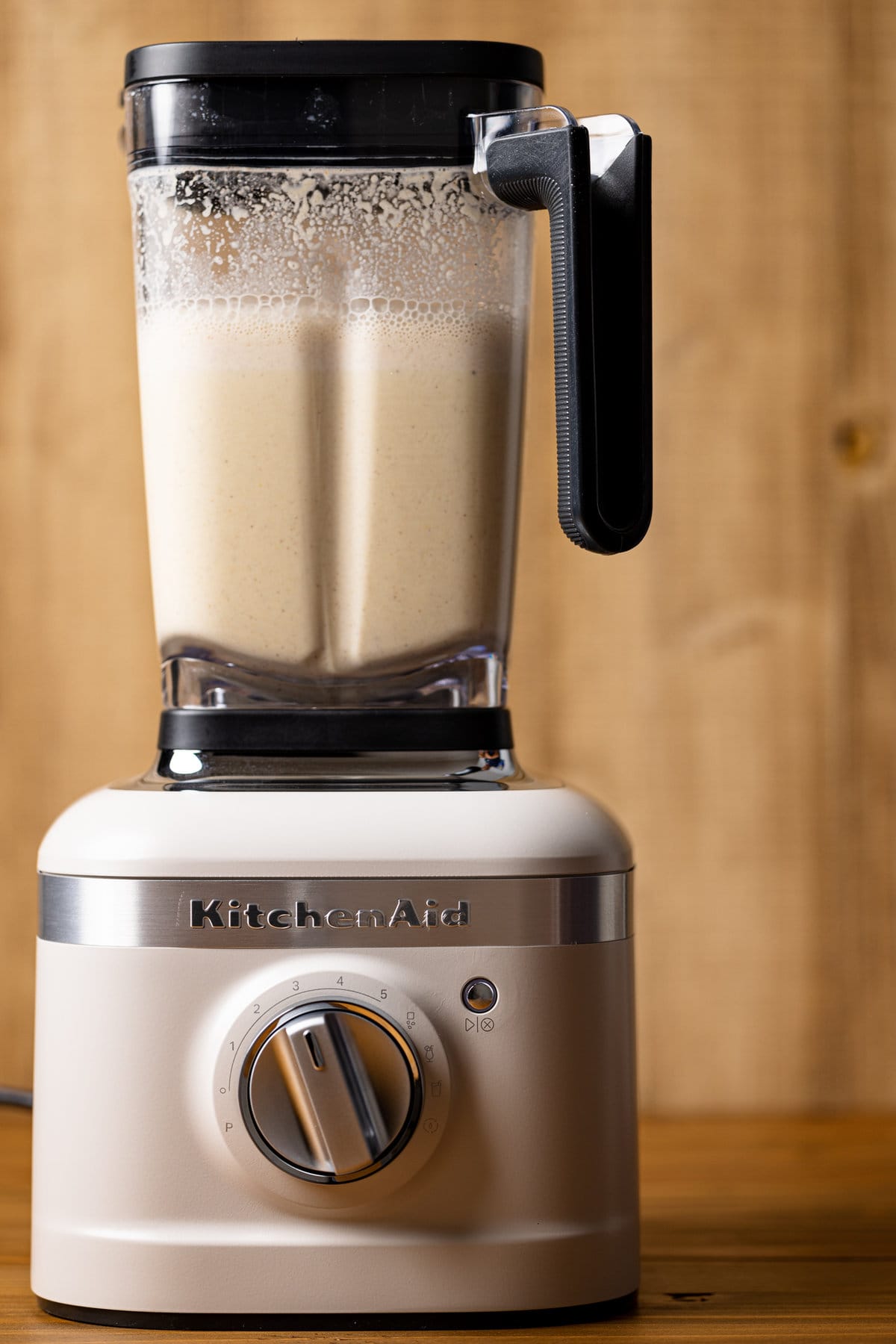 Blender filled with Creamy Homemade Vegan Eggnog.