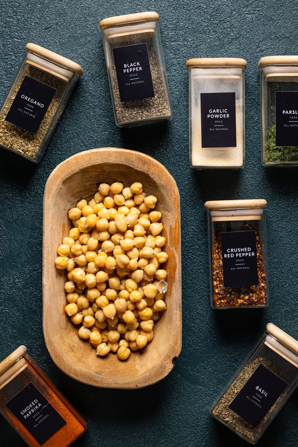 Ingredients for Vegan Cheese Polenta with Pesto and Chickpeas, including crushed red pepper, garlic powder, and smoked paprika