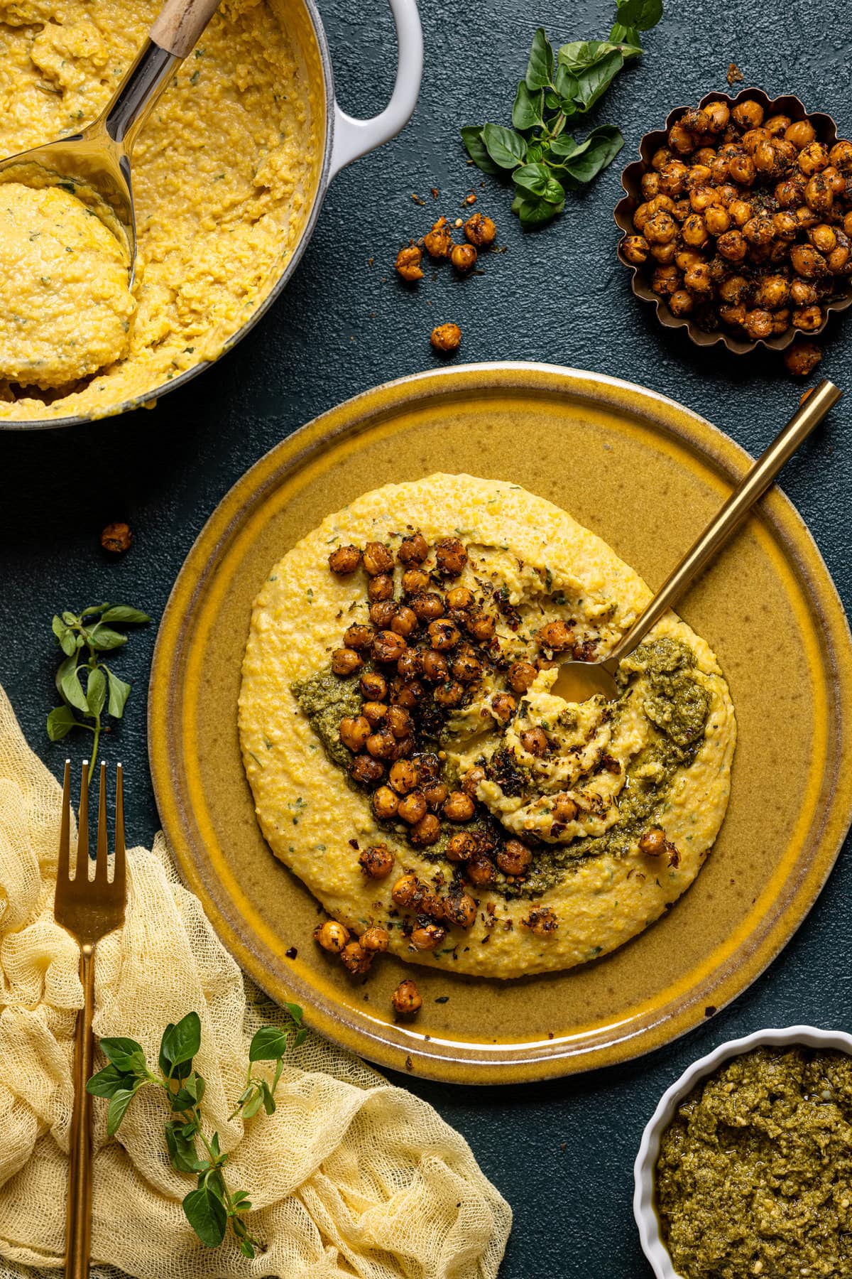 Overhead shot of a plate of Vegan Cheese Polenta with Pesto and Chickpea