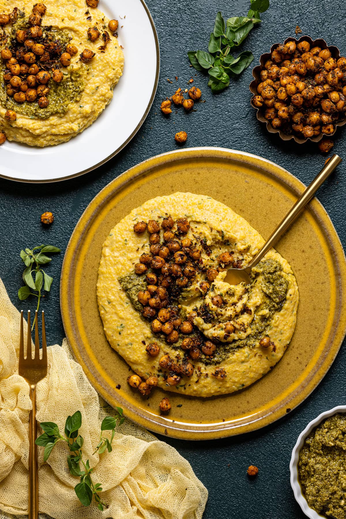 Overhead shot of a plate of Vegan Cheese Polenta with Pesto and Chickpea
