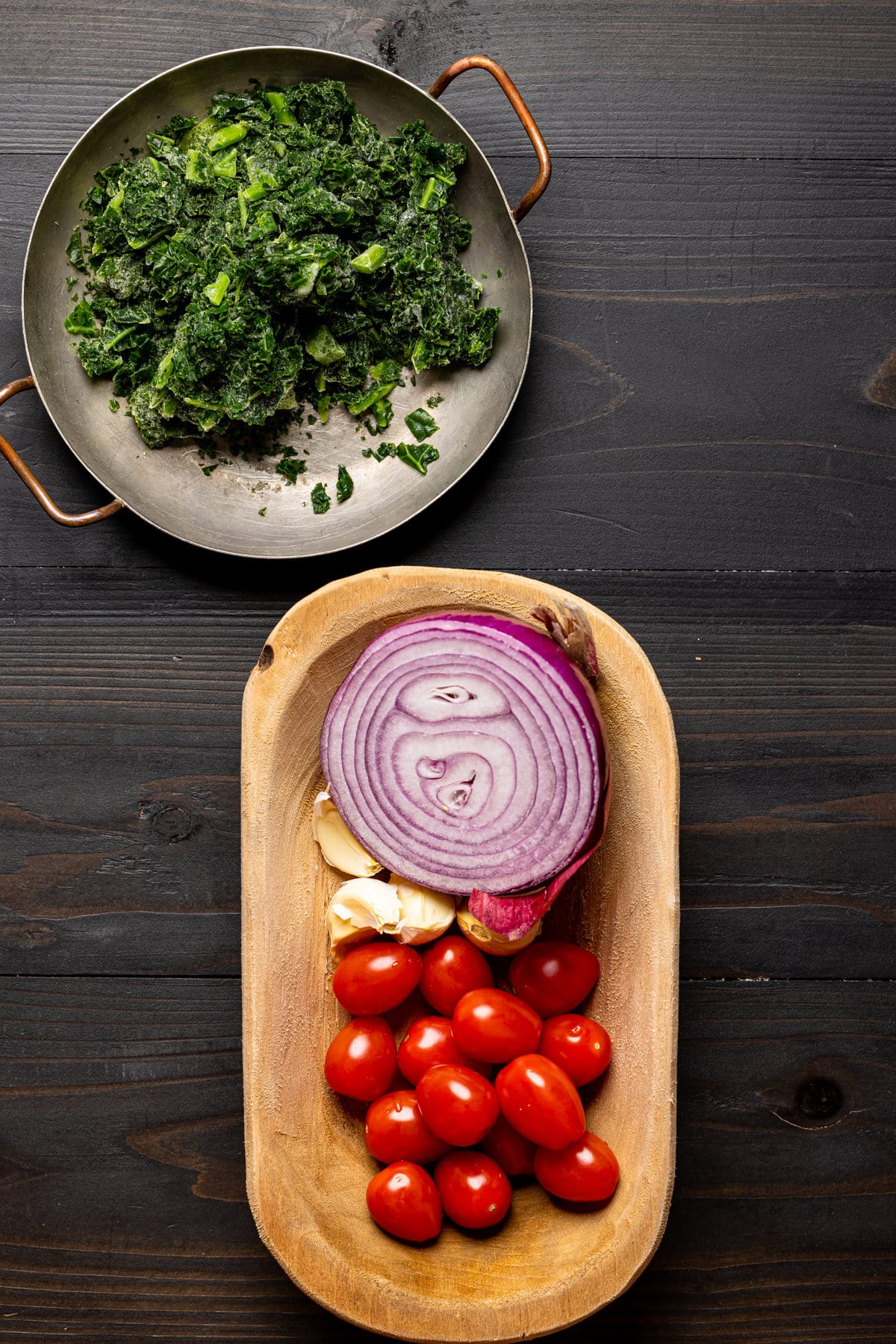 Ingredients for Delicious Vegan Lasagna Soup including cherry tomatoes, red onion, and garlic