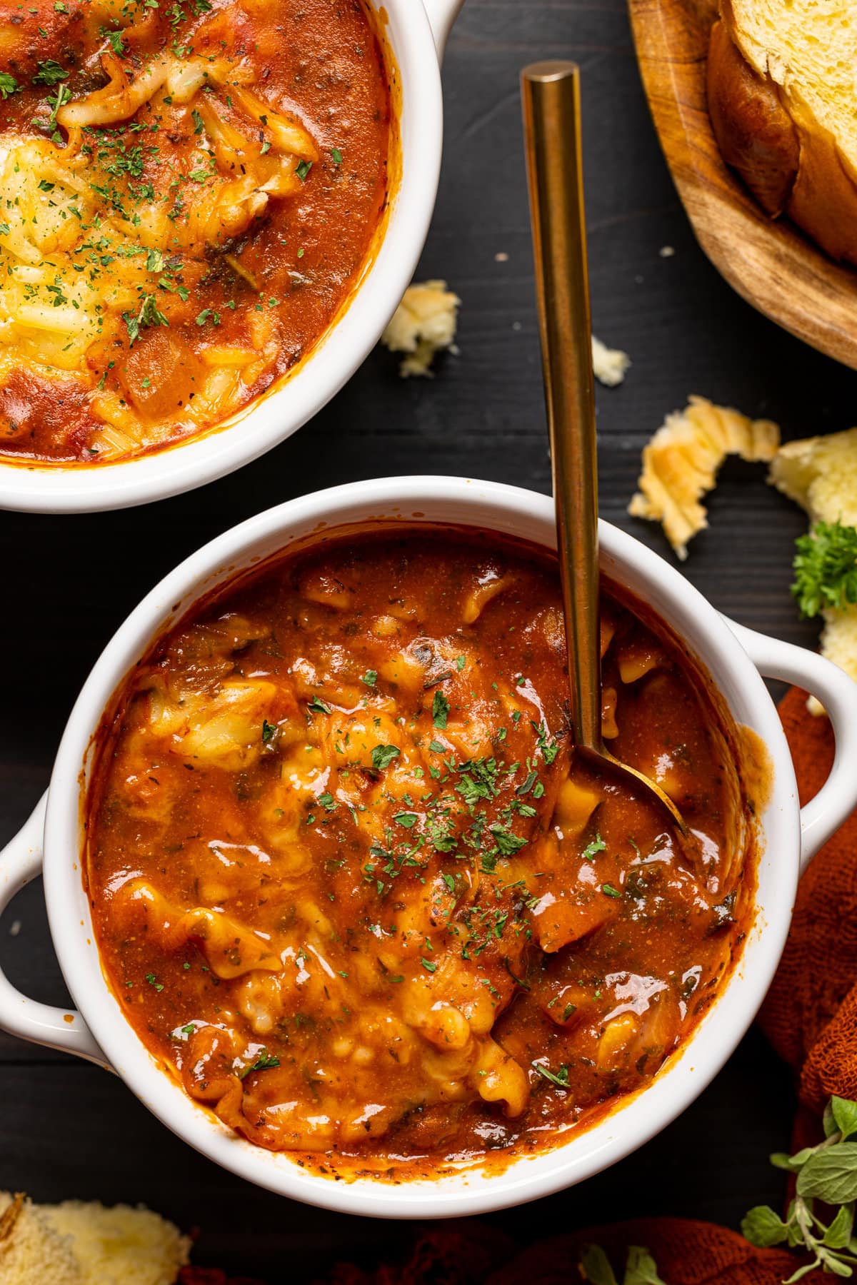 Closeup of a bowl of Vegan Lasagna Soup with a spoon