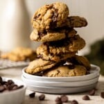 Stack of Vegan Chocolate Chip Cookies on three small, stacked plates