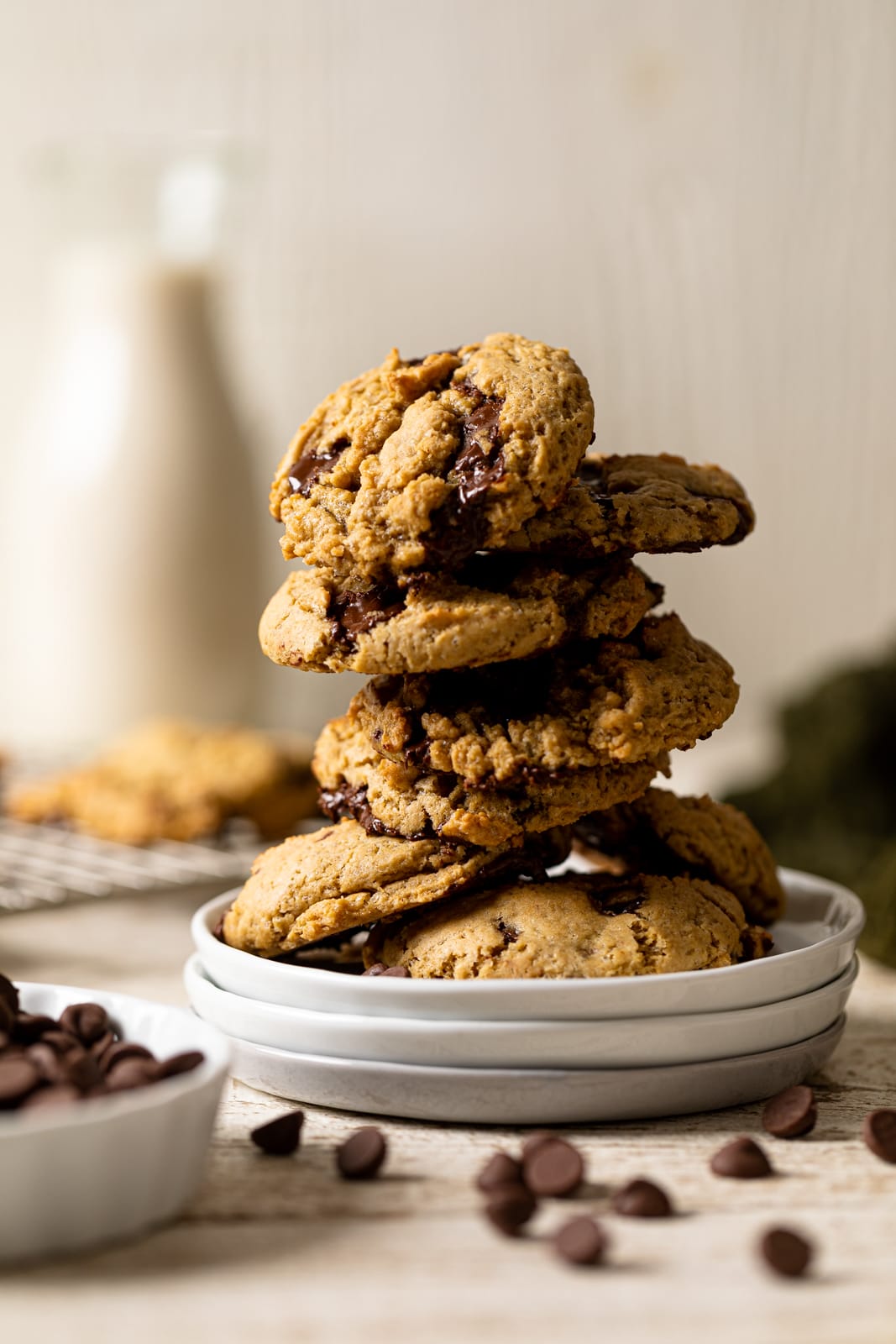 Stack of Vegan Chocolate Chip Cookies on three small, stacked plates