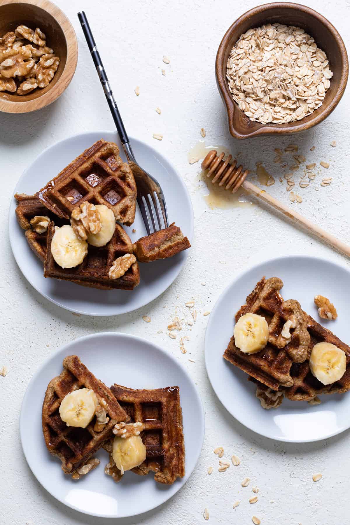 Flourless Vegan Banana Oats Waffles on small plates.