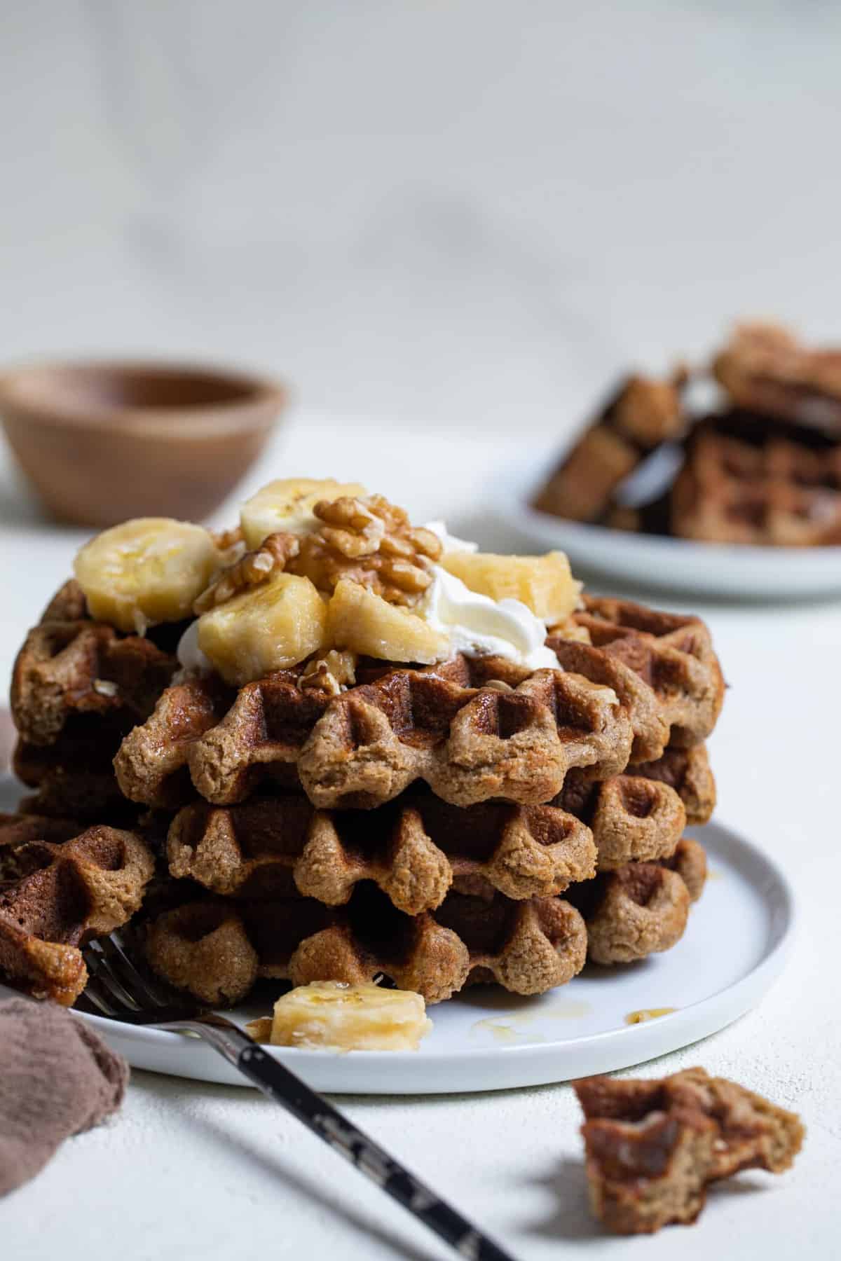 Flourless Vegan Banana Oats Waffles on a white plate.