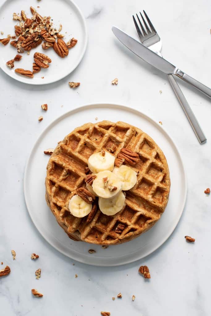 Flourless Vegan Banana Oats Waffles on a white plate.